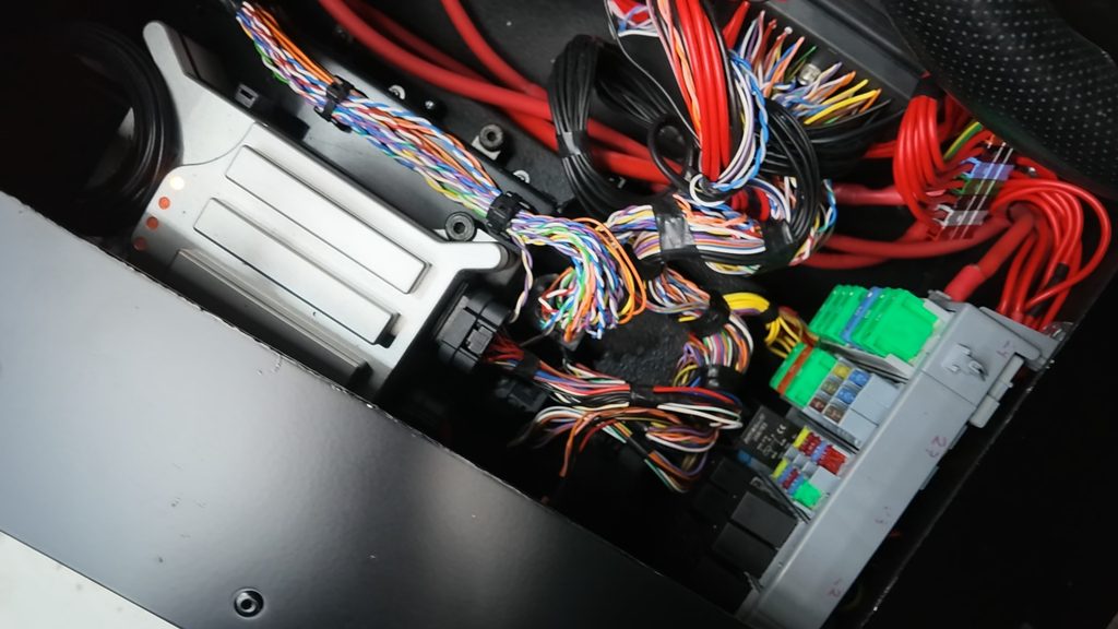 Moduline M1 under the driver seat of a Land Rover Defender